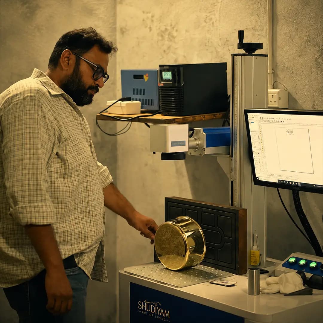 Shudyam artisan working on a brass product
